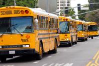 FILE PHOTO: School bus drivers take part in caravan to demand proper funding for schools to support distant learning and a safe return to classes, in Los Angeles