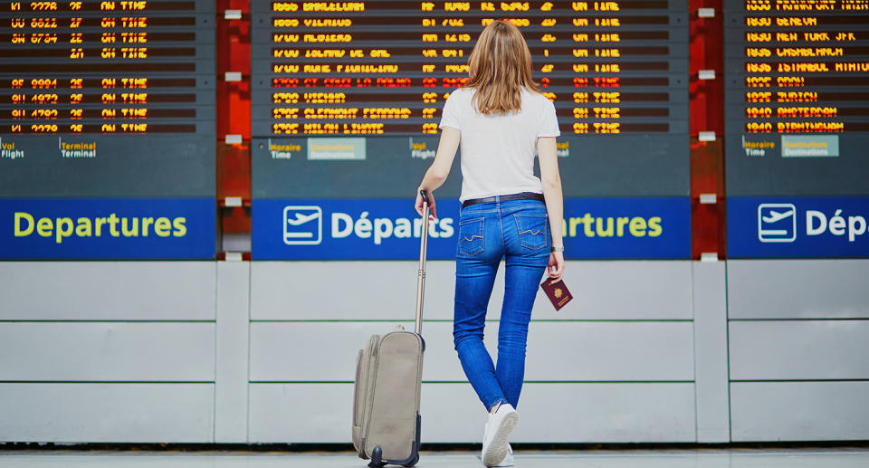 Woman arriving at airport for flight. (Getty Images)