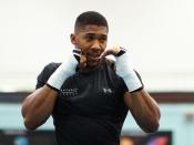 Anthony Joshua vs Carlos Takam: British heavyweight defends WBA and IBF titles by stopping Takam in the tenth round