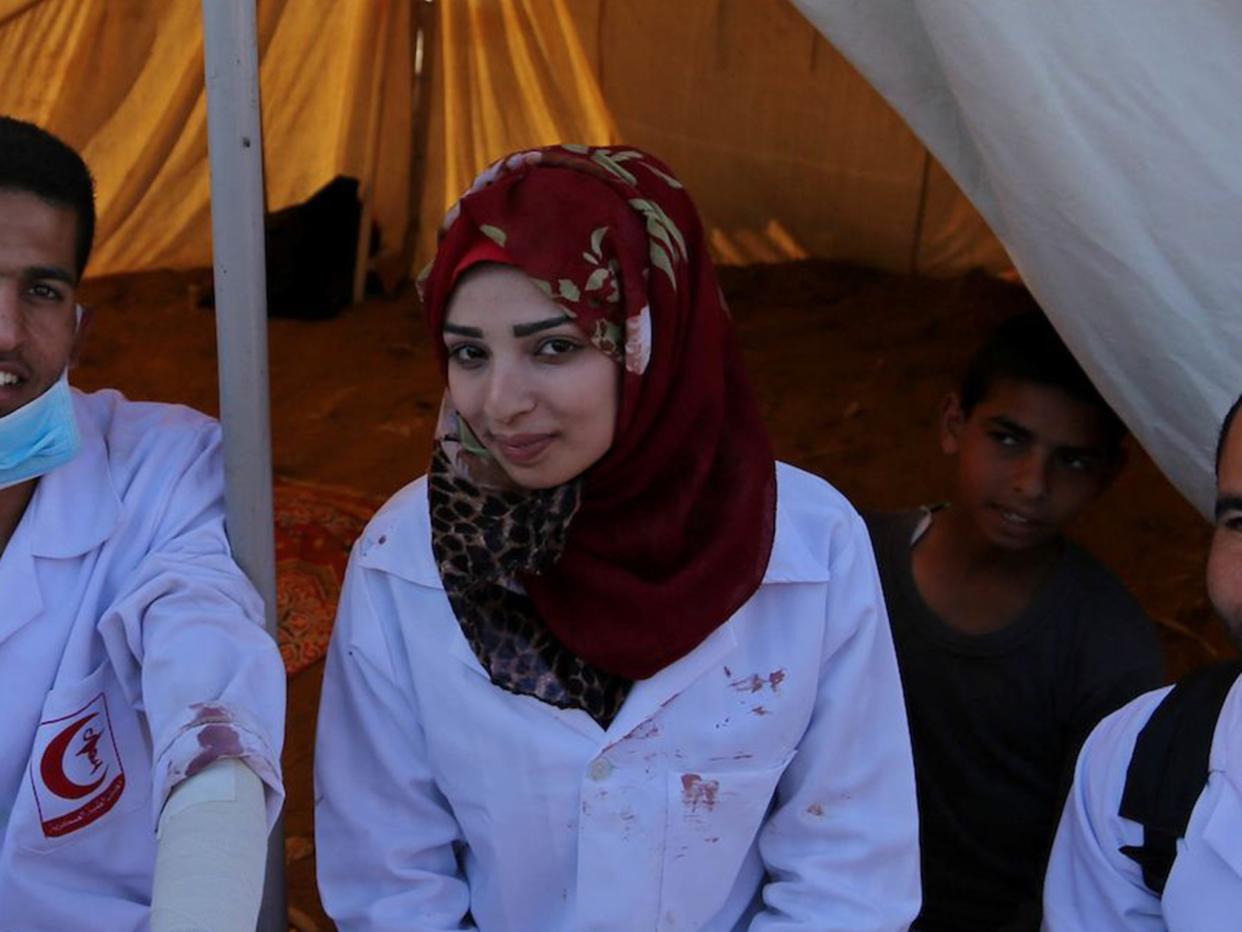 Najjar was often photographed on the front line with the blood of her patients spattered on her white medic’s uniform: Rex