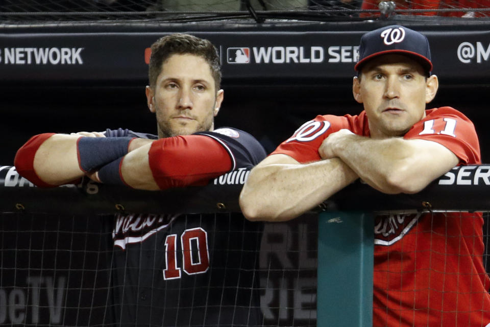 Washington Nationals catcher Yan Gomes, left, and first baseman Ryan Zimmerman watch during the ninth inning of Game 5 of the baseball World Series against the Houston Astros Sunday, Oct. 27, 2019, in Washington. (AP Photo/Patrick Semansky)