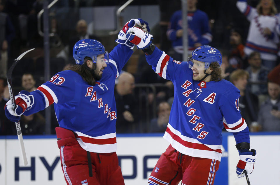 New York Rangers center Mika Zibanejad, left, congratulates Artemi Panarin after Panarin's goal against the New York Islanders during the first period of an NHL hockey game Thursday, Dec. 22, 2022, in New York. (AP Photo/John Munson)