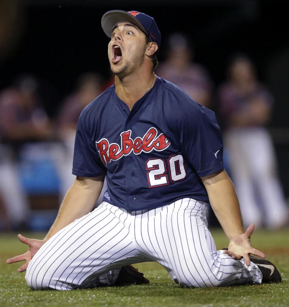 Mississippi pitcher Josh Laxer (20) celebrates after throwing the final out of an NCAA college baseball tournament super regional game against Louisiana Lafayette in Lafayette, La.,Monday, June 9, 2014. Mississippi won 10-4 to advance to the College World Series. (AP Photo/Gerald Herbert)