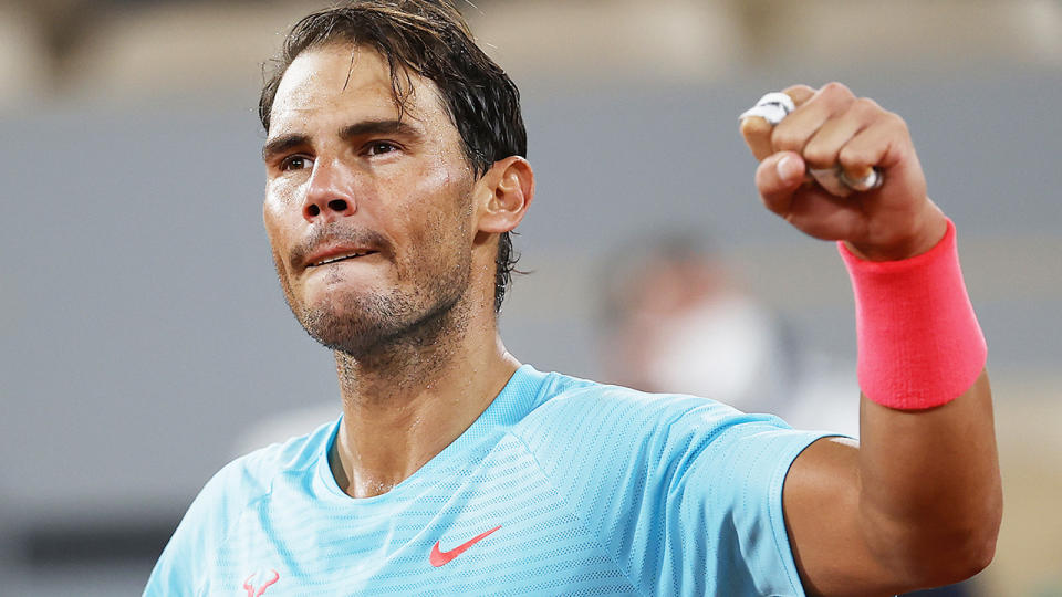 Rafael Nadal is pictured celebrating after defeating Stefano Travaglia at the French Open.