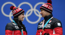 <p>Canada’s gold medallists Tessa Virtue (L) and Scott Moir pose on the podium during the medal ceremony for the figure skating ice dance at the Pyeongchang Medals Plaza during the Pyeongchang 2018 Winter Olympic Games in Pyeongchang on February 20, 2018. / AFP PHOTO / Fabrice COFFRINI (Photo credit should read FABRICE COFFRINI/AFP/Getty Images) </p>