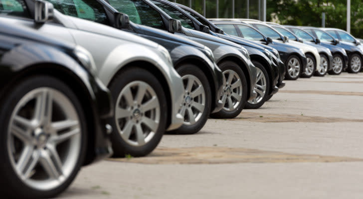 the front wheels of a series of cars in a line