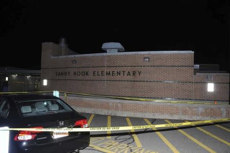 The car driven by Adam Lanza is pictured at Sandy Hook Elementary School in Newtown, Connecticut, in this evidence photo released by the Connecticut State Police, December 27, 2013. REUTERS/Connecticut State Police/Handout via Reuters