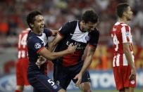 Paris St Germain's Thiago Motta (2nd R) celebrates with his teammate Marquinhos after scoring against Olympiakos during their Group C Champions League soccer match at Karaiskaki stadium in Piraeus near Athens September 17, 2013. REUTERS/John Kolesidis (GREECE - Tags: SPORT SOCCER)