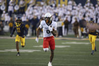 Cincinnati's Braden Smith (0) carries the ball after a catch during the second half of an NCAA college football game against West Virginia, Saturday, Nov. 18, 2023, in Morgantown, W.Va. (AP Photo/Chris Jackson)