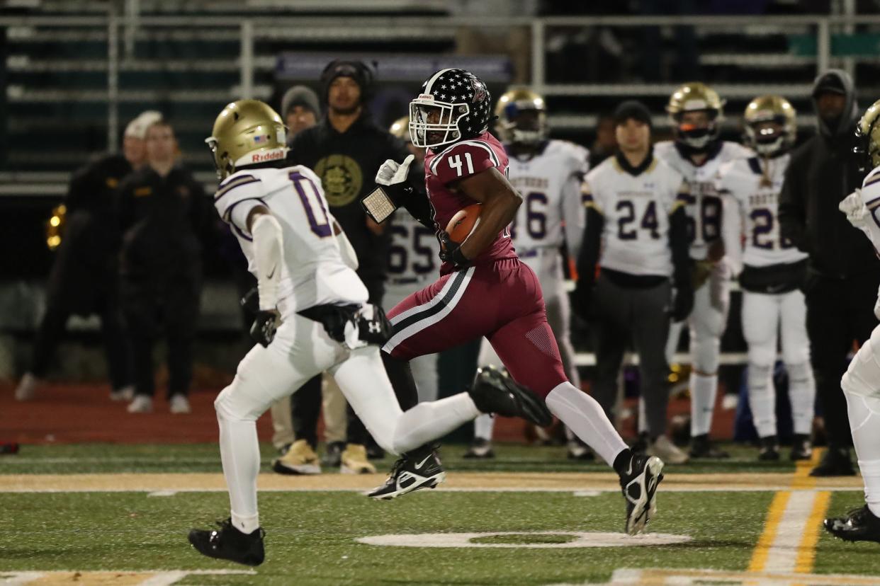 Amir Williams from Elmira is able to get around the corner for good yardage in CBA's 49-20 victory in a NYSPHSAA Class AA quarterfinal Nov. 18, 2023 at Vestal.