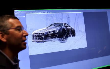 Nvidia's public relations officer Danny Shapiro speaks near a graphic display of an Audi automobile in Santa Clara, California in this February 11, 2015 file photo. REUTERS/Robert Galbraith