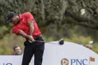 Tiger Woods tees off on the 13th hole during the final round of the PNC Championship golf tournament, Sunday, Dec. 17, 2023, in Orlando, Fla. (AP Photo/Kevin Kolczynski)
