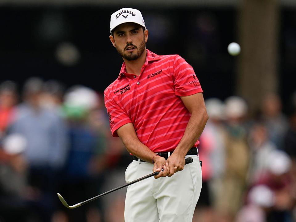 Abraham Ancer chips onto the green at the 2022 PGA Championship.