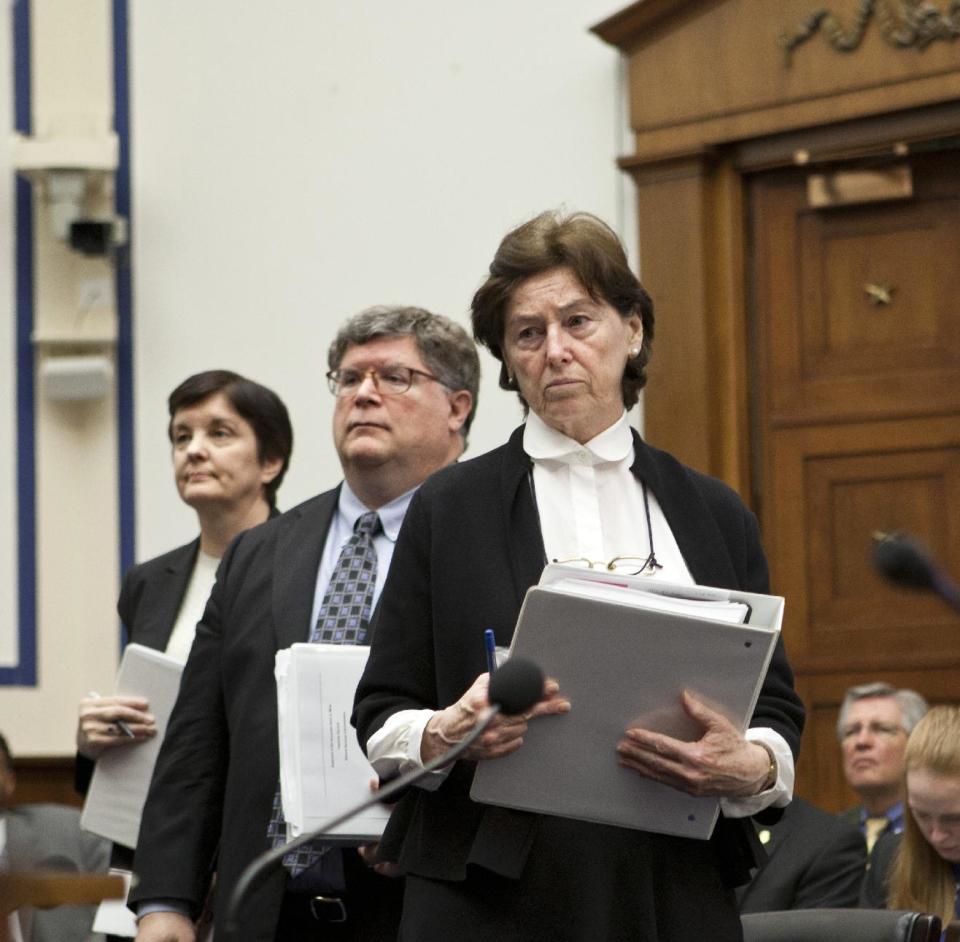 From right to left, GSA Deputy Administrator Susan Brita, GSA Inspector General Brian Miller, and GSA Chief Financial Officer Alison Doone, arrive on Capitol Hill in Washington, Tuesday, April 17, 2012, to testify before the House Economic Development, Public Buildings and Emergency Management subcommittee hearing of an excessive conference at a Las Vegas resort by General Services Administration officials in 2010. (AP Photo/J. Scott Applewhite)