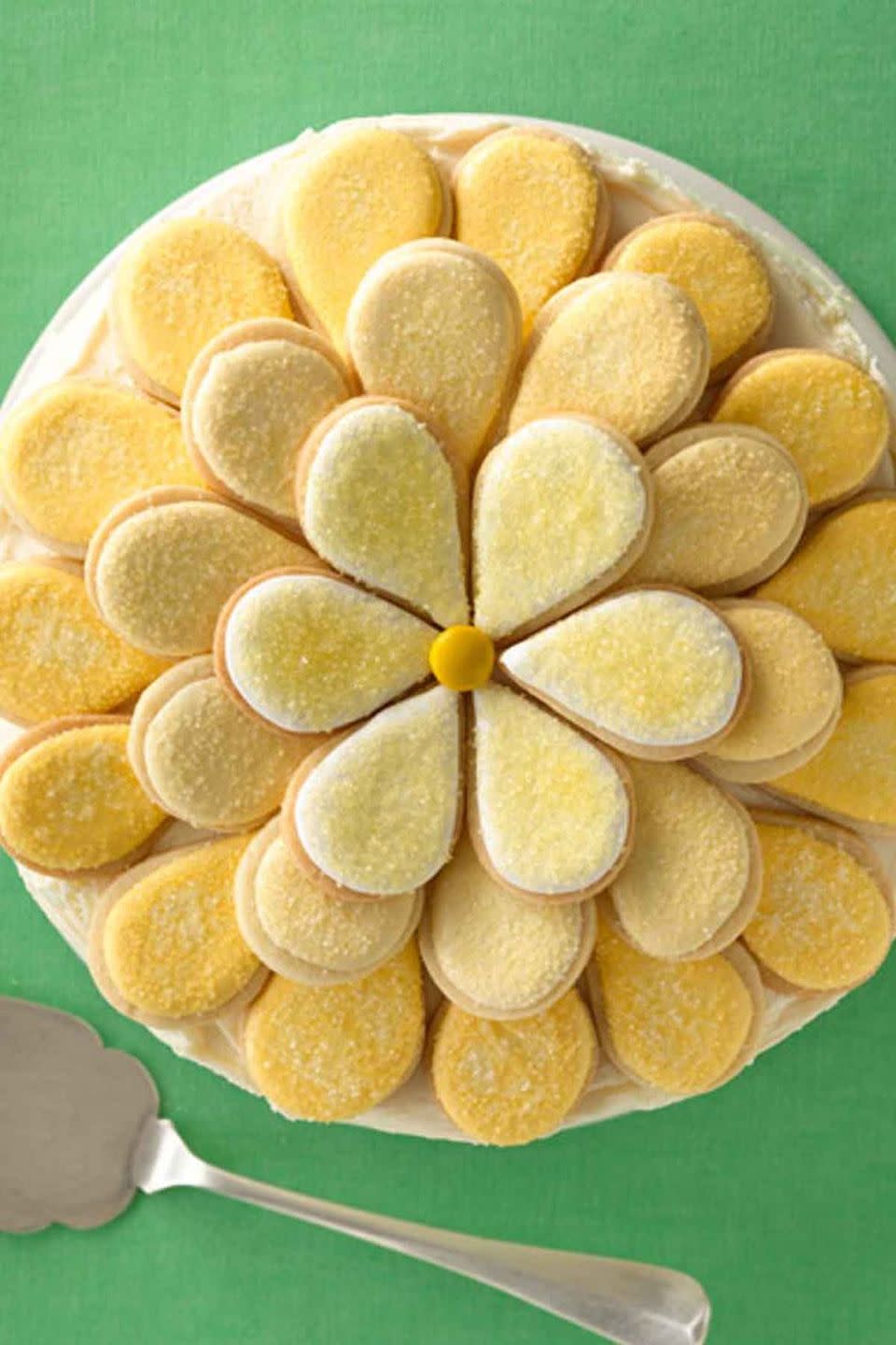 <p>Make this incredible cake by baking a batch of sugar cookie petals and assembling them in the shape of a daisy. </p><p>Get the <strong><a href="https://www.womansday.com/food-recipes/food-drinks/recipes/a11896/daisy-cake-recipe/" rel="nofollow noopener" target="_blank" data-ylk="slk:Daisy Cake recipe.;elm:context_link;itc:0;sec:content-canvas" class="link ">Daisy Cake recipe.</a></strong></p>