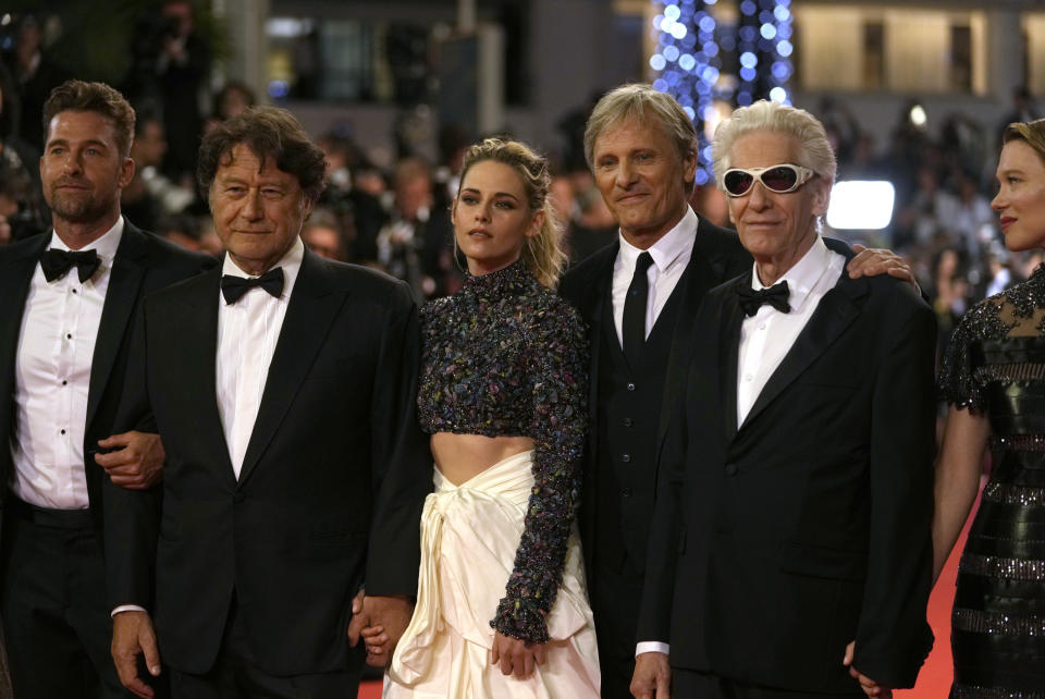 Scott Speedman, from left, producer Robert Lantos, Kristen Stewart, Viggo Mortensen, director David Cronenberg, and Lea Seydoux pose for photographers upon arrival at the premiere of the film 'Crimes of the Future' at the 75th international film festival, Cannes, southern France, Monday, May 23, 2022. (AP Photo/Petros Giannakouris)