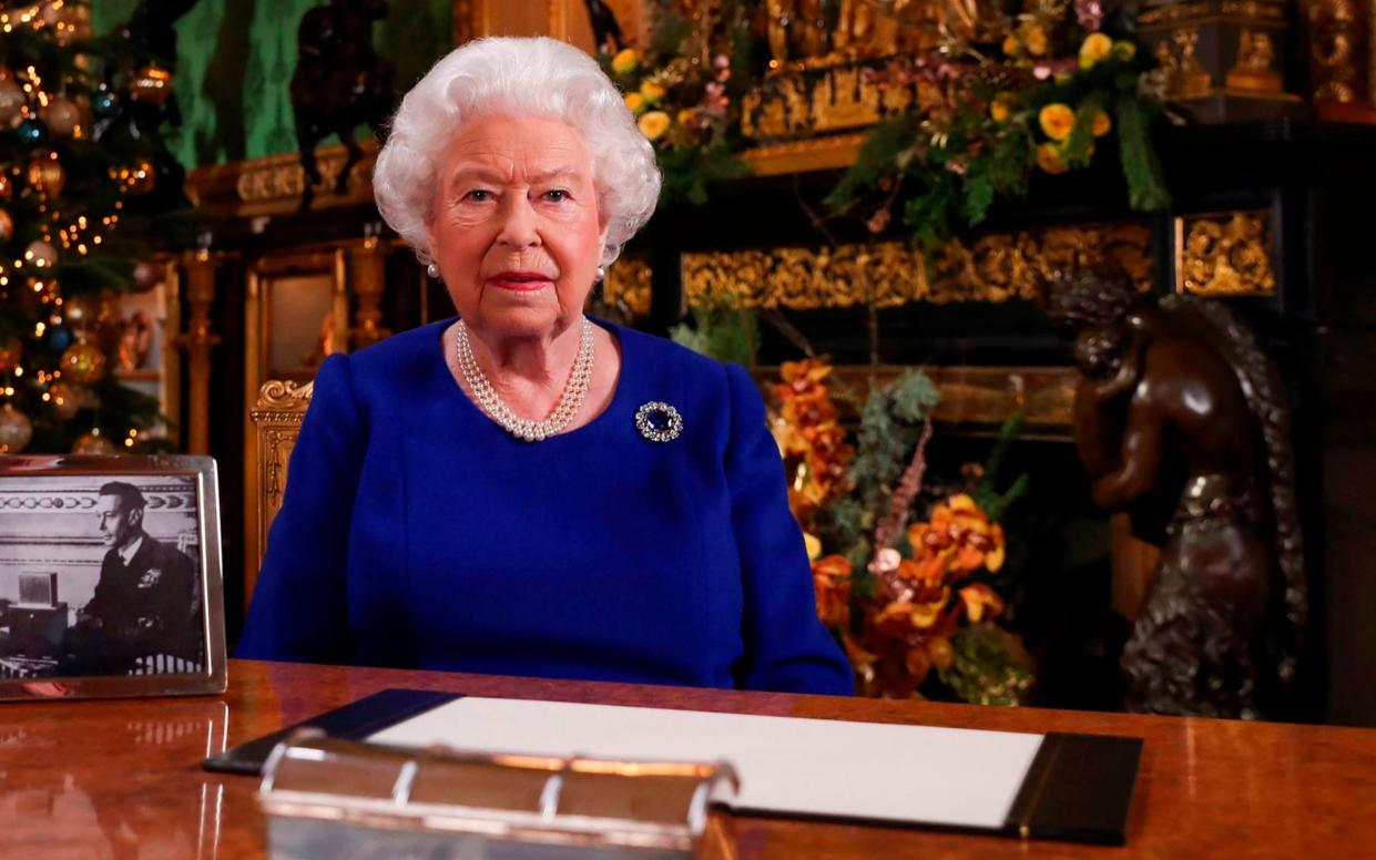 Britain's Queen Elizabeth II posing for a photograph after she recorded her annual Christmas Day message in Windsor Castle - Queen's address to the nation on Coronavirus: When is it, and where can you watch the speech - GETTY IMAGES