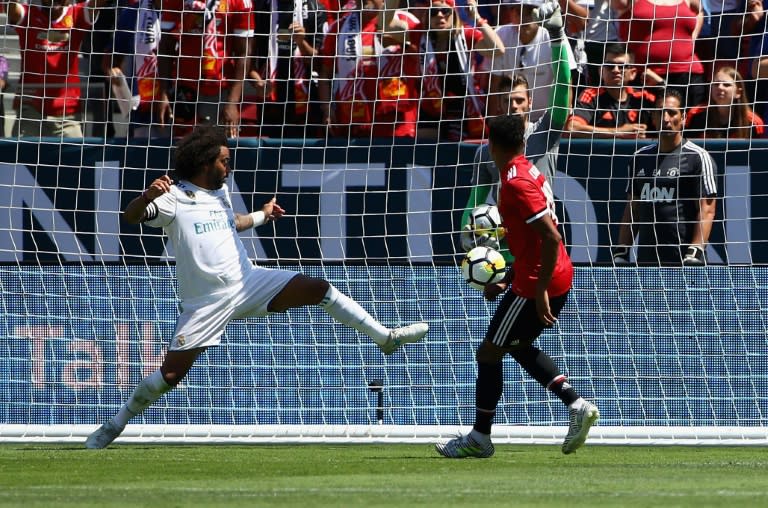 Jesse Lingard of Manchester United scores past Marcelo Da Silva Junior of Real Madrid during their International Champions Cup match, at Levi's Stadium in Santa Clara, California, on July 23, 2017