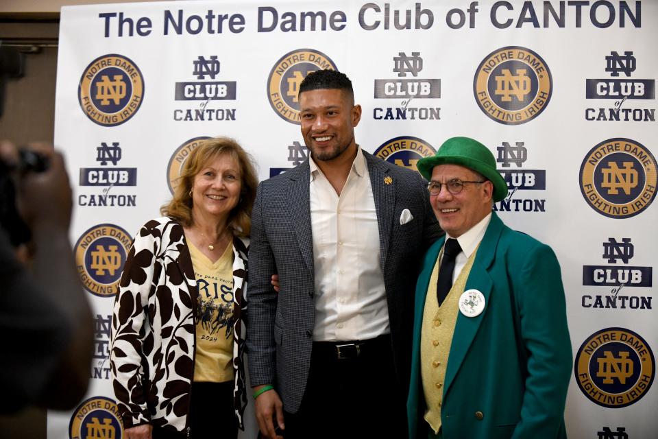 Marion and Michael DePasquale of Canton meet University of Notre Dame Head Football Coach Marcus Freeman during his visit to the Notre Dame Club of Canton event at Massillon Eagles Post 190 Tuesday, May 07, 2024.