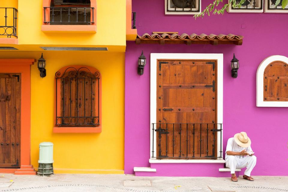 <p>The bold colors of Mexico are exaggerated on the walls on this home.</p>