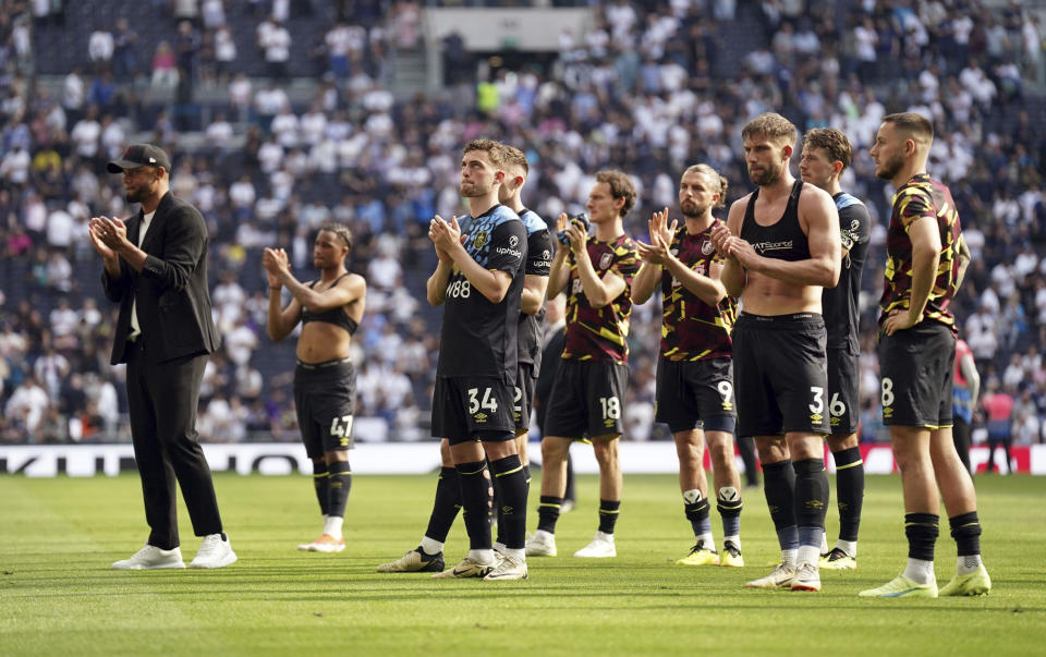Burnley players alongside manager Vincent Kompany stand dejected after their relegations was confirmed, following the English Premier League soccer match between Tottenham Hotspur and Burnley, at the Tottenham Hotspur Stadium, London, Saturday May 11, 2024. (Adam Davy/PA via AP)
