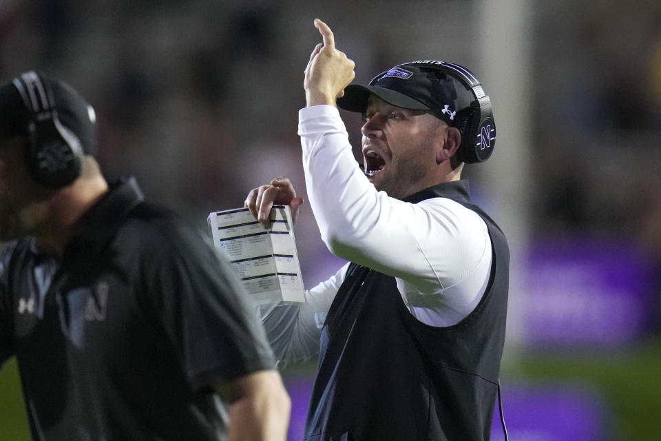 Northwestern interim head coach David Braun calls a time out during the first half of an NCAA college football game against Minnesota, Saturday, Sept. 23, 2023, in Evanston, Ill. (AP Photo/Erin Hooley)