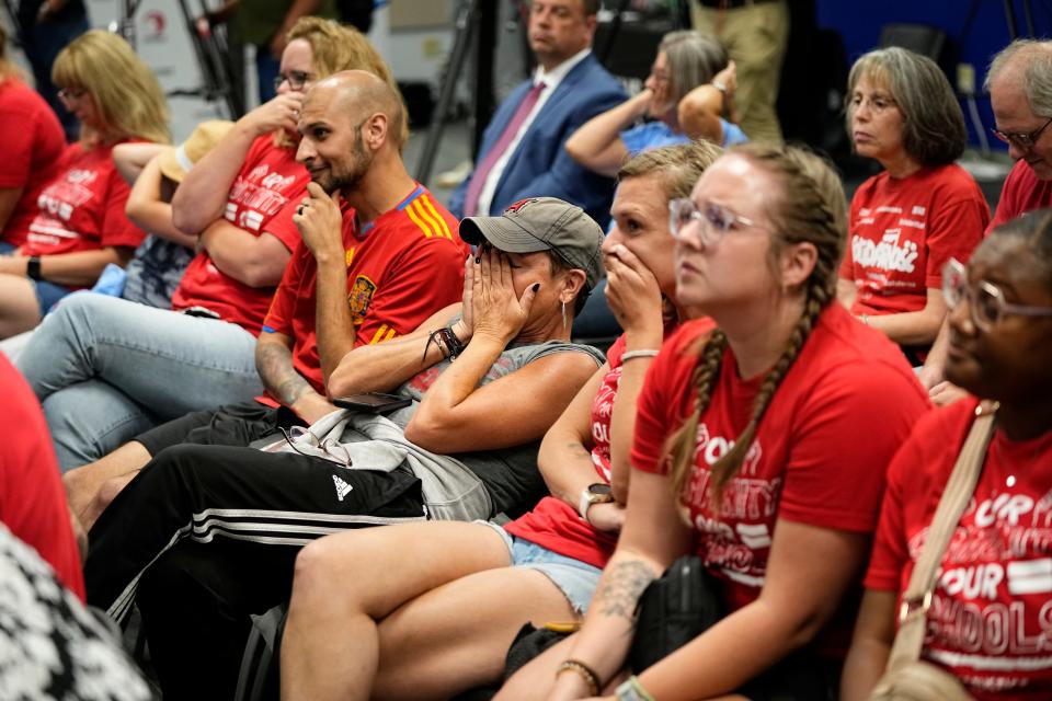 Jun 25, 2024; Columbus, Ohio, USA; The public in attendance reacts as school closures and consolidation are announced during a meeting of the Columbus City Schools board.