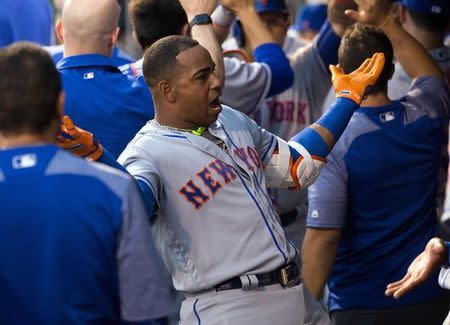 Apr 11, 2017; Philadelphia, PA, USA; New York Mets left fielder Yoenis Cespedes (52) reacts in the dugout after hitting a three RBI home run against the Philadelphia Phillies during the first inning at Citizens Bank Park. Mandatory Credit: Bill Streicher-USA TODAY Sports