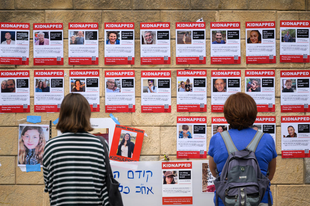 Photos of some of those taken hostage by Hamas during their recent attacks are seen on October 18, 2023 in Tel Aviv, Israel. (Leon Neal/Getty Images)