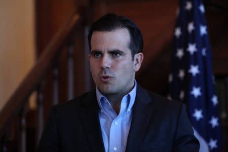 FILE PHOTO - Puerto Rico Governor Ricardo Rossello speaks during a Facebook live broadcast in the library of the governor's mansion, in San Juan, Puerto Rico January 24, 2018. REUTERS/Alvin Baez