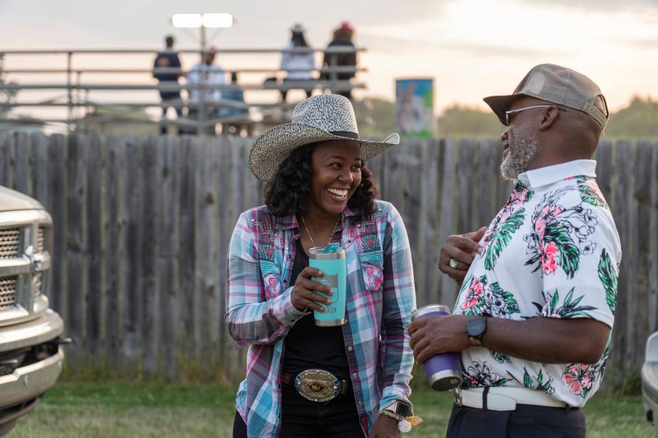 Staci Russell, 39, center, of Belleville, shares a laugh with her boyfriend, Duwayne Ruffin, 45, of Kokomo, Ind., after competing in the barrel races for the two-day 2023 Midwest Invitational Rodeo at the Wayne County Fairgrounds in Belleville on Saturday, June 10, 2023.