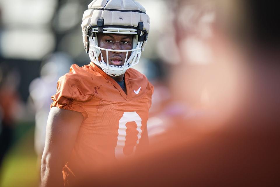 Texas linebacker Anthony Hill Jr. warms up prior to a spring practice in March. Hill, after playing well as a freshman at multiple spots, will shore up the middle linebacker spot this season left open by the vacated Jaylan Ford.