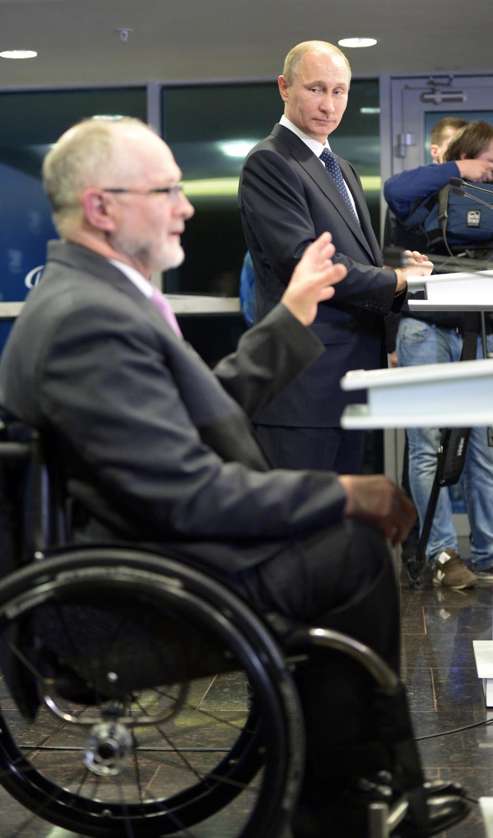 Russian President Vladimir Putin, right, and International Paralympic Committee President Philip Craven speak before the opening ceremony of the 2014 Winter Paralympics in Sochi, Russia, Friday, March 7, 2014. (AP Photo/RIA-Novosti, Alexei Nikolsky, Presidential Press Service)