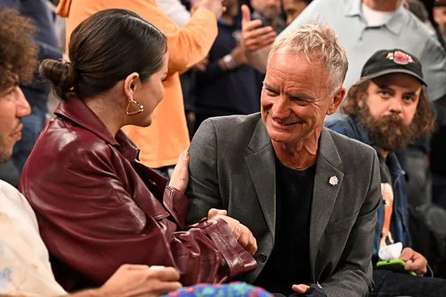 <p>David Dow/NBAE via Getty</p> Selena Gomez (left) shaking hands with Sting in New York City on April 22, 2024