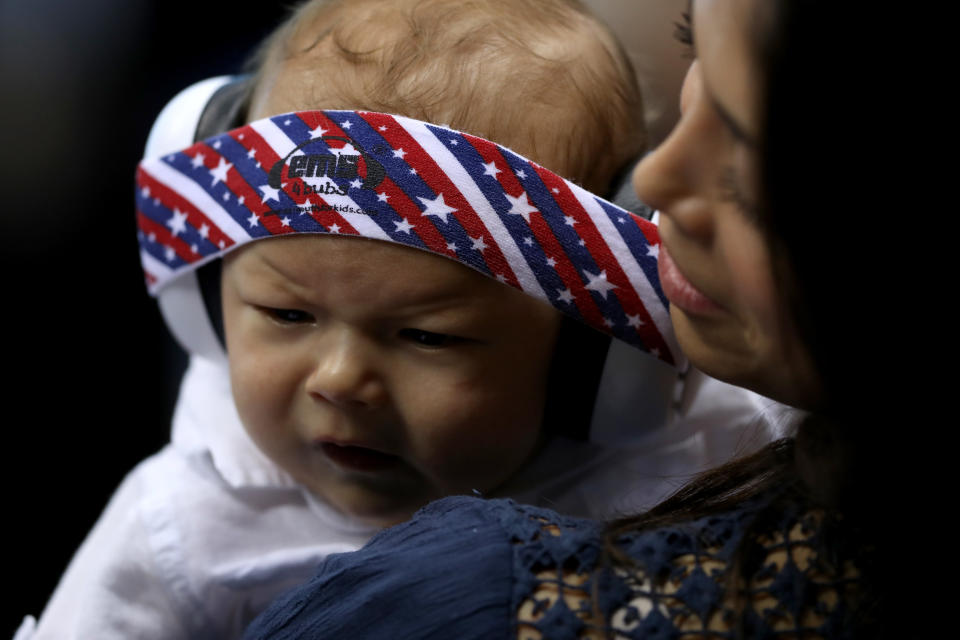 RIO DE JANEIRO, BRAZIL - AUGUST 11:  Nicole Johnson, fiancee of Michael Phelps of the United States, holds their son Boomer during the evening swim session on Day 6 of the Rio 2016 Olympic Games at the Olympic Aquatics Stadium on August 11, 2016 in Rio de Janeiro, Brazil.  (Photo by Al Bello/Getty Images)