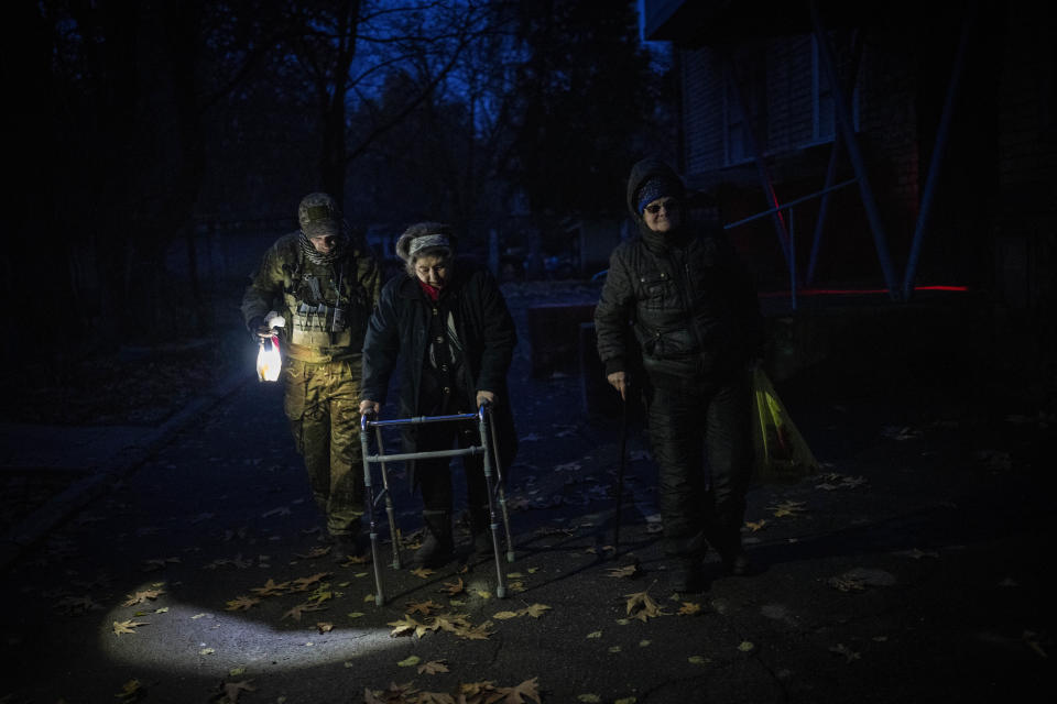 Elderly residents are evacuated from the southern city of Kherson, Ukraine, on Nov. 27. 