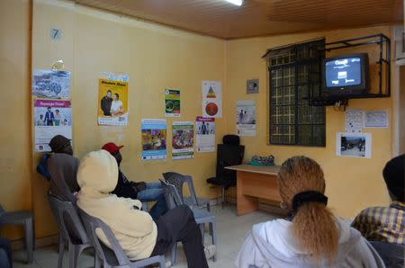 Patients watch television at Nairobi Outreach Services Trust (NOSET) in Nairobi, Kenya, July 13, 2016. REUTERS/Neha Wadekar