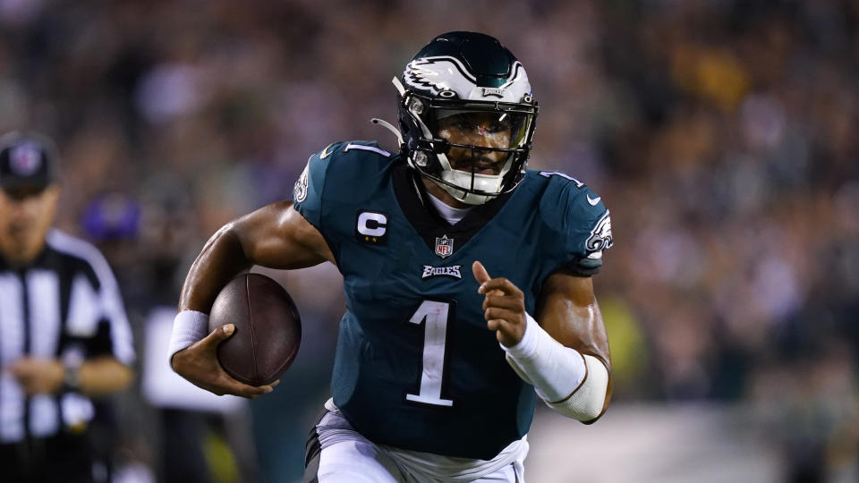 Philadelphia Eagles quarterback Jalen Hurts (1) runs down the field during the first half of an NFL football game against the Minnesota Vikings on Monday.