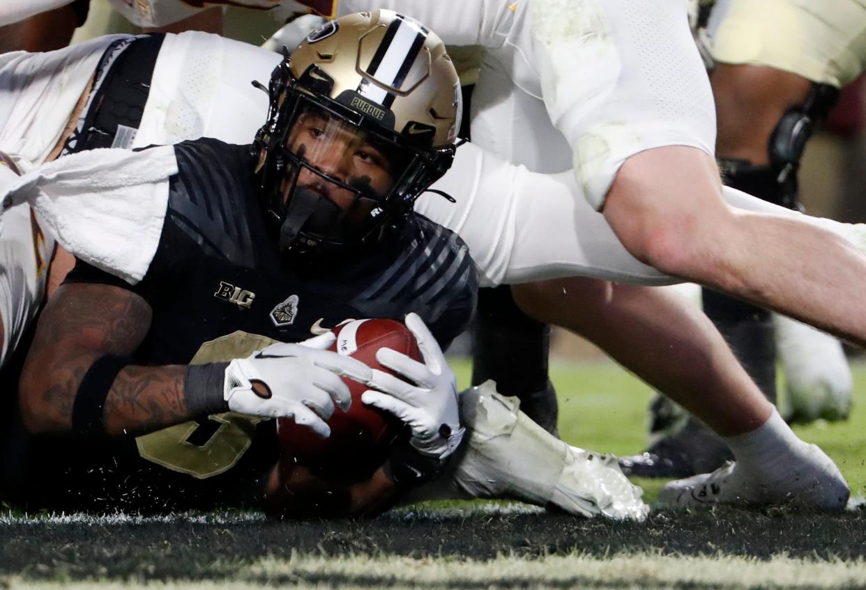 Purdue Boilermakers running back Tyrone Tracy Jr. (3) dives into the end zone for a touchdown during the NCAA football game against the Minnesota Golden Gophers, Saturday, Nov. 11, 2023, at Ross-Ade Stadium in West Lafayette, Ind. Purdue Boilermakers won 49-30.