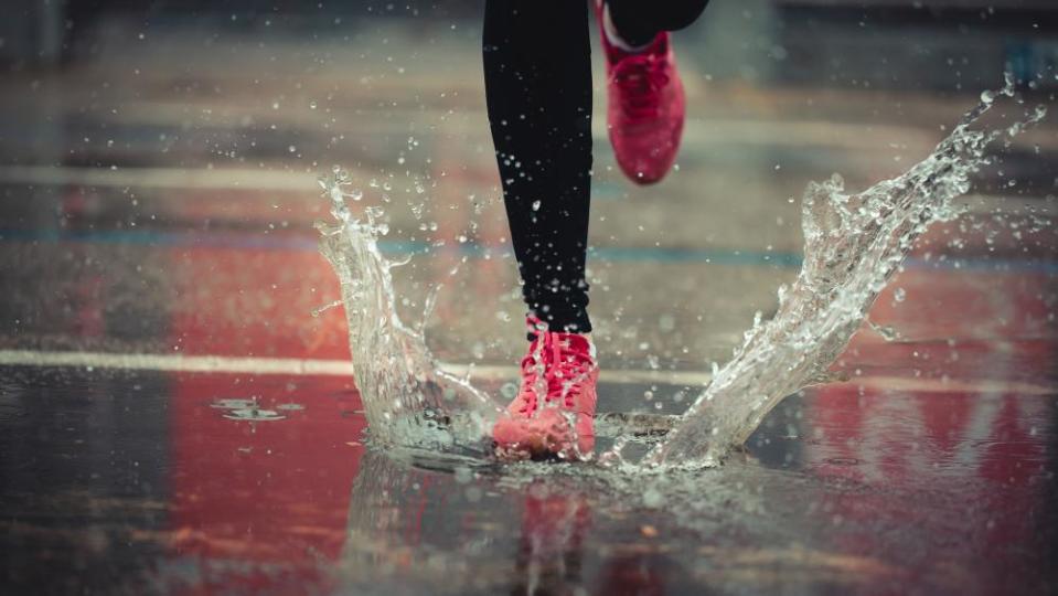 Runner on a wet pavement