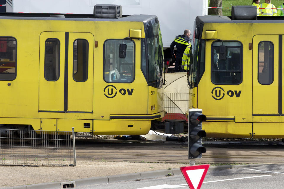 A body is covered with a white sheet after a shooting in a tram in Utrecht, Netherlands, Monday, March 18, 2019. (Photo: Peter Dejong/AP)