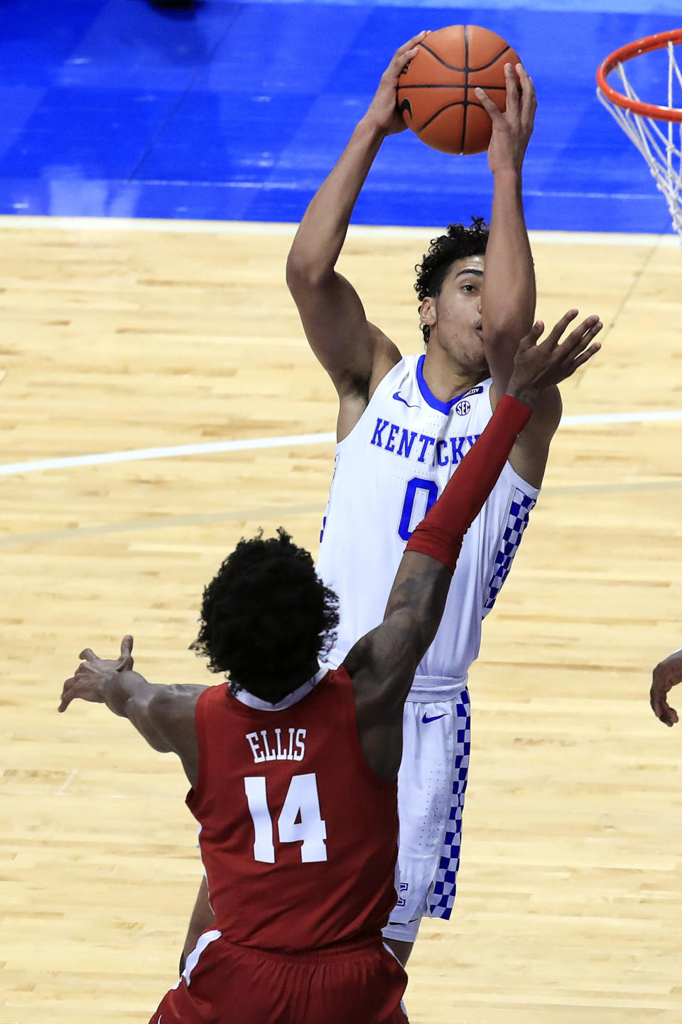 Kentucky's Jacob Toppin shoots as Alabama's Keon Ellis (14) defends during the second half of an NCAA college basketball game in Lexington, Ky., Tuesday, Jan. 12, 2021. (AP Photo/James Crisp)