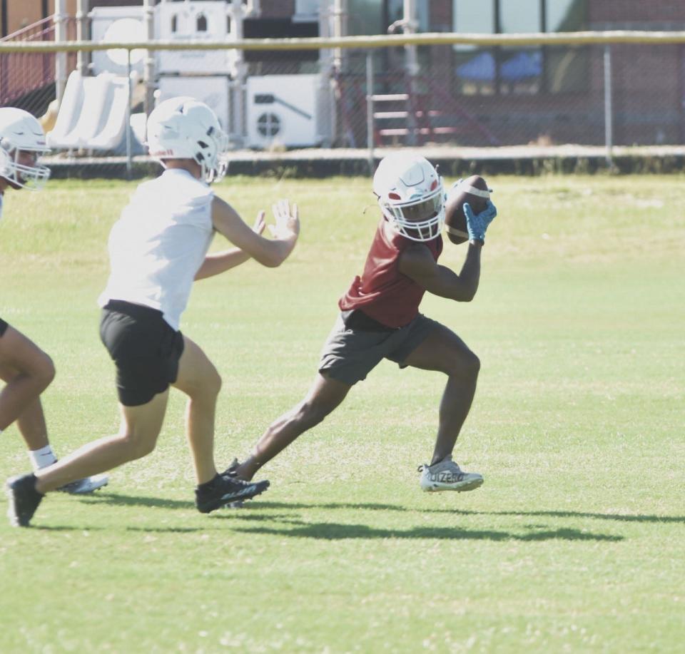 South Effingham's Jamari Fields eludes a teammates during a recent preseason practice.