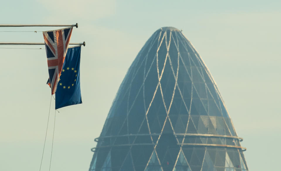 UK and EU flags fly close to the City of London (Getty)