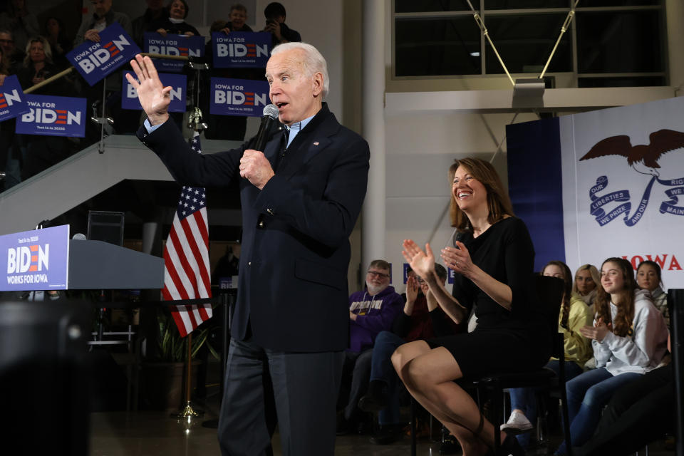 ANKENY, IOWA - JANUARY 25: Democratic presidential candidate former Vice President Joe Biden (L) is joined by Rep. Cindy Axne (D-IA) during a town hall meeting inside the John Deere Exhibition Hall at the FFA Enrichment Center January 25, 2020 in Ankeny, Iowa. While three of the top-polling Democratic presidential candidates are U.S. Senators and must be in Washington for the impeachment trial of President Donald Trump, Biden continues to campaign across Iowa ahead of its all-important February 03 caucuses.  (Photo by Chip Somodevilla/Getty Images)