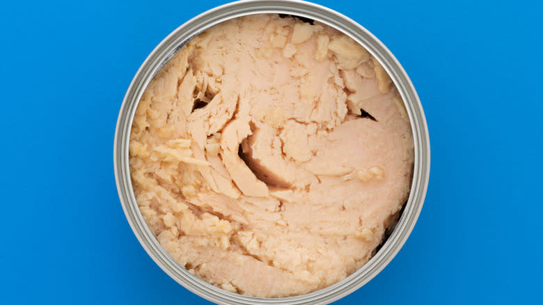 solid tuna in can from overhead view