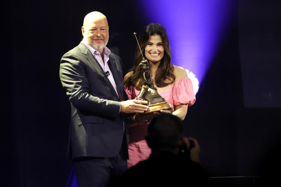 Actor Idina Menzel and Bob Chapek, Chief Executive Officer of Disney, pose as she is honored at the 2022 Disney Legends Awards during Disney's D23 Expo in Anaheim, California, U.S., September 9, 2022.  REUTERS/Mario Anzuoni