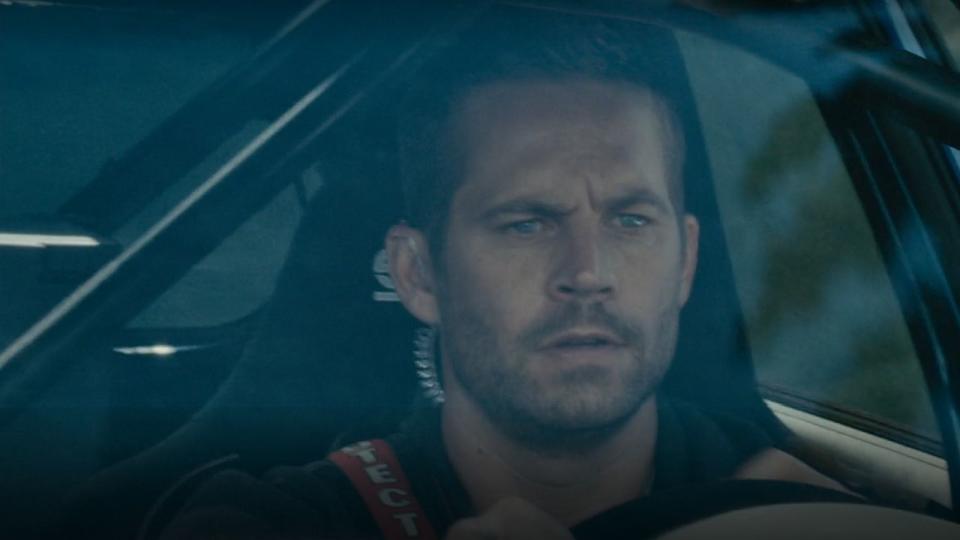 Paul Walker driving in Furious 7