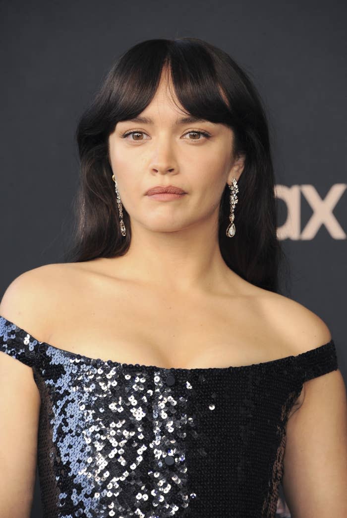 A closeup of Olivia in a sequined off-shoulder dress