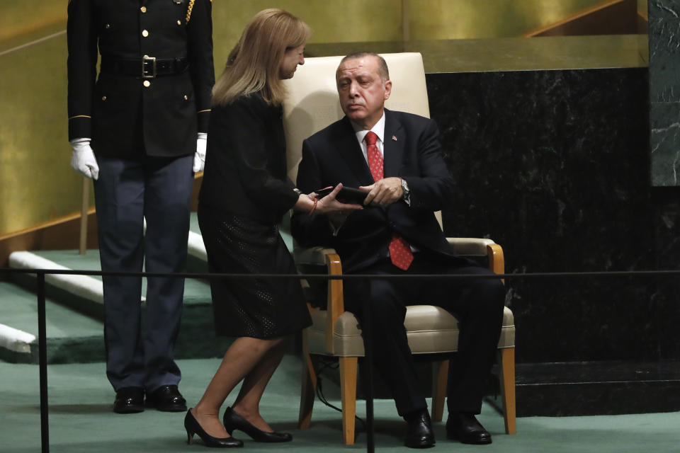 Turkey's President Recep Tayyip Erdogan hands off his speech following his address to the 73rd session of the United Nations General Assembly, at U.N. headquarters, Tuesday, Sept. 25, 2018. (AP Photo/Richard Drew)